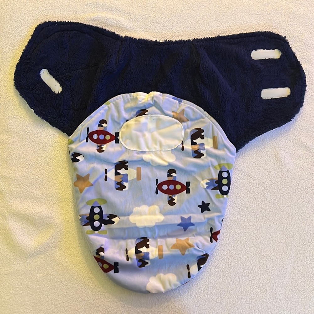 Baby Wrap/Swaddle blue in color, micro-fleece, airplane print.